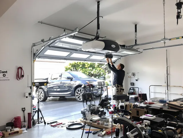Stallings Garage Door Repair specialist installing smart garage door opener system in Stallings home