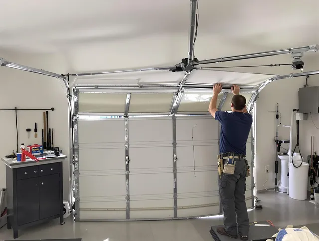 Stallings Garage Door Repair specialist performing precise section replacement on Stallings garage door