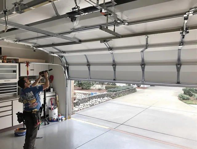 Garage door track repair service by Stallings Garage Door Repair in Stallings